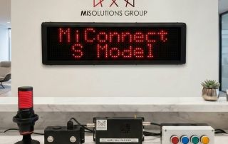 MiSolutions Group MiConnect S Model digital school bell and alert system with LED display, warning beacon, control unit and emergency buttons.
