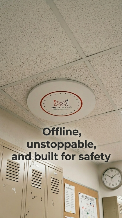 Ceiling-mounted MiSolutions vape detection device installed in a school hallway, with lockers and a wall clock visible below, highlighting offline safety monitoring.